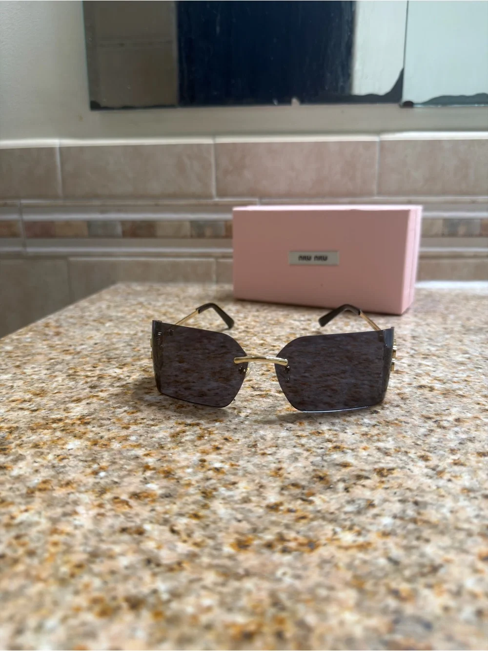 Miu Miu Rimless Sunglasses with Black Lenses and Gold Temples